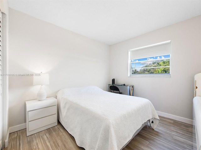 bedroom with light hardwood / wood-style flooring