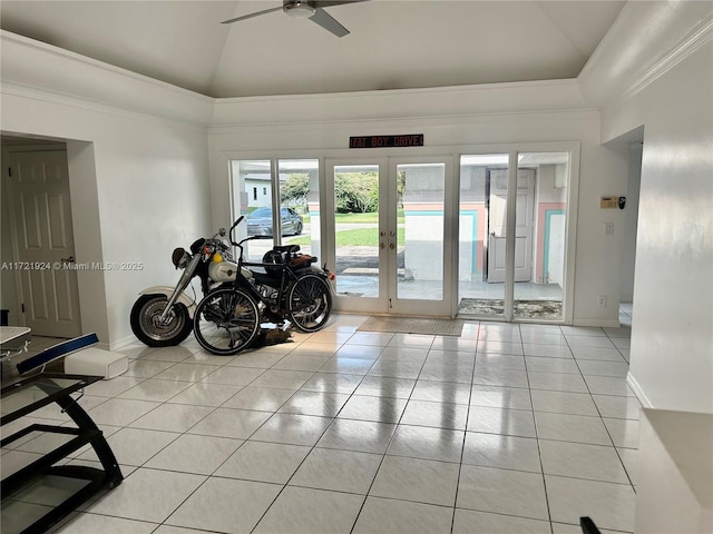 workout room with ceiling fan, light tile patterned floors, high vaulted ceiling, and french doors