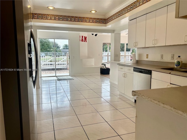 kitchen featuring white cabinetry, dishwasher, crown molding, and light tile patterned flooring