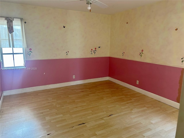 unfurnished room featuring ceiling fan and light hardwood / wood-style floors