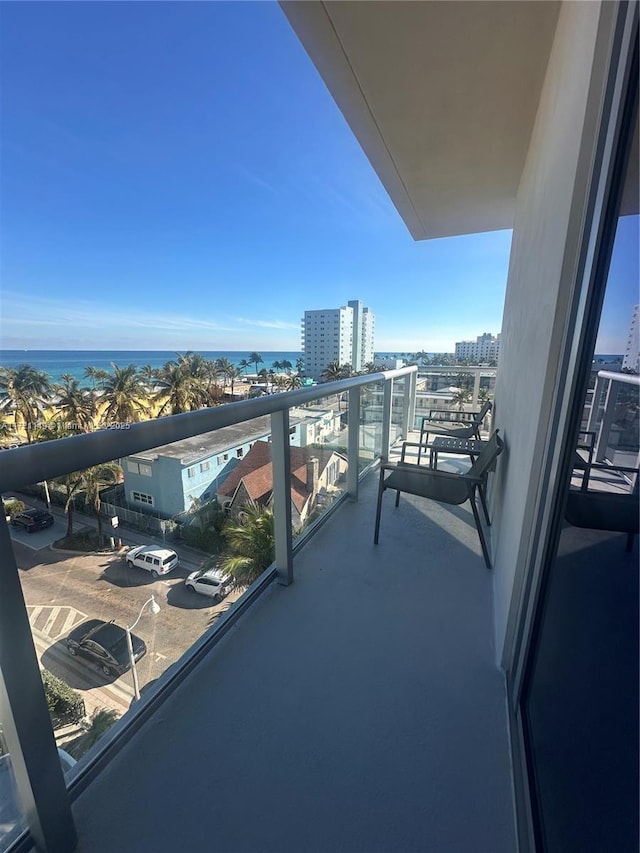 balcony featuring a water view