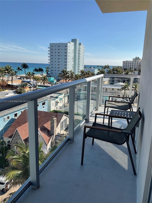 balcony featuring a water view