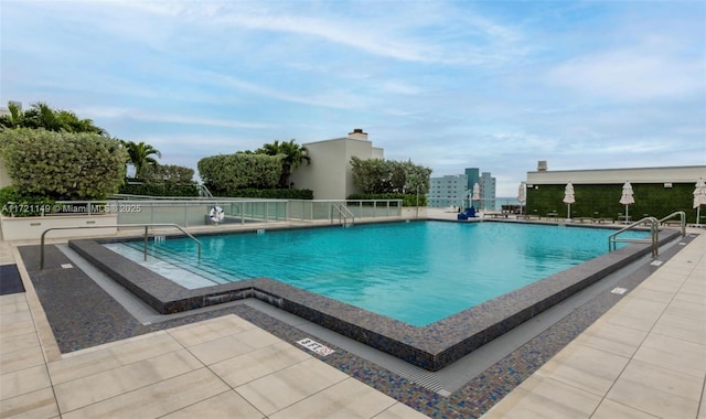 view of swimming pool featuring a patio