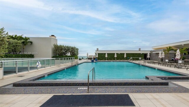 view of pool featuring a patio area