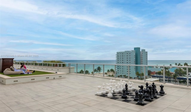 view of patio with a water view