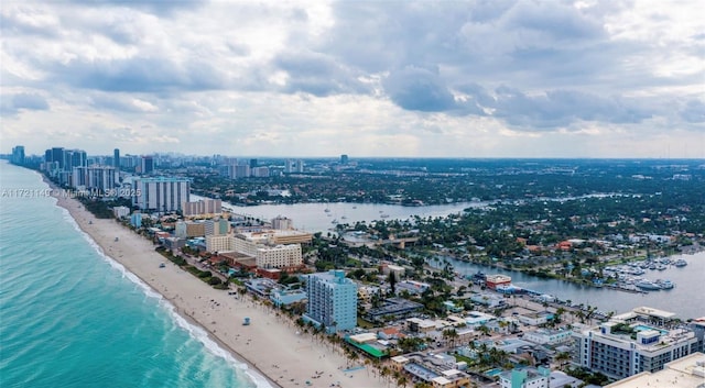 aerial view featuring a water view and a beach view