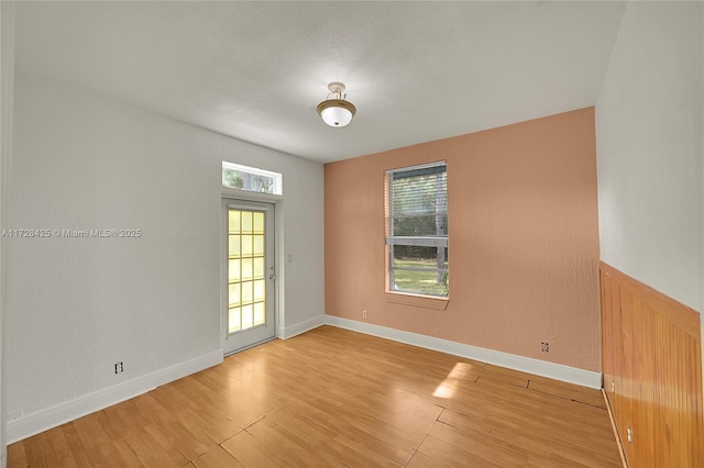 unfurnished room featuring light hardwood / wood-style floors