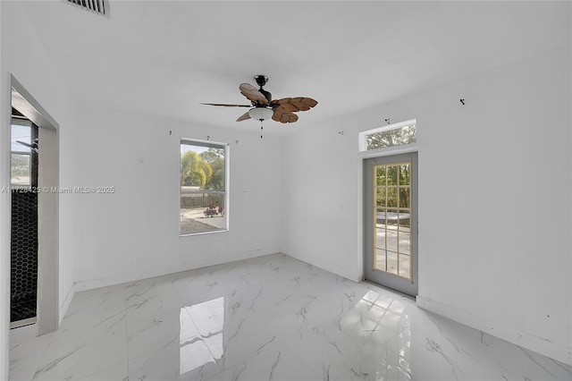 spare room featuring ceiling fan