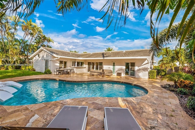 view of swimming pool with a patio