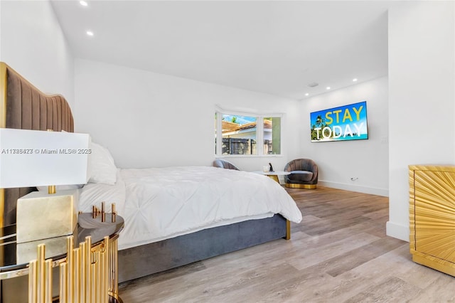 bedroom with wood-type flooring