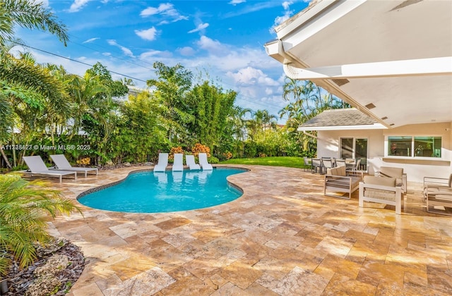 view of swimming pool with an outdoor hangout area and a patio