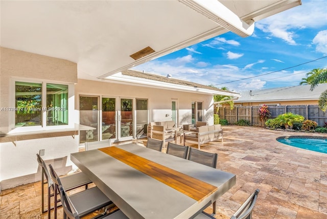 view of patio with a fenced in pool and an outdoor hangout area