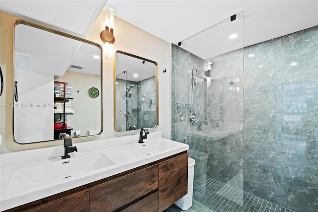 bathroom featuring vanity and a tile shower