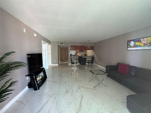 living room with a textured ceiling