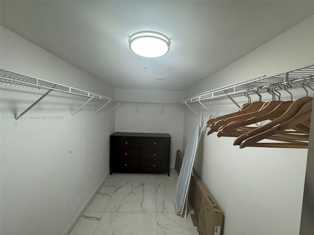 walk in closet with an AC wall unit