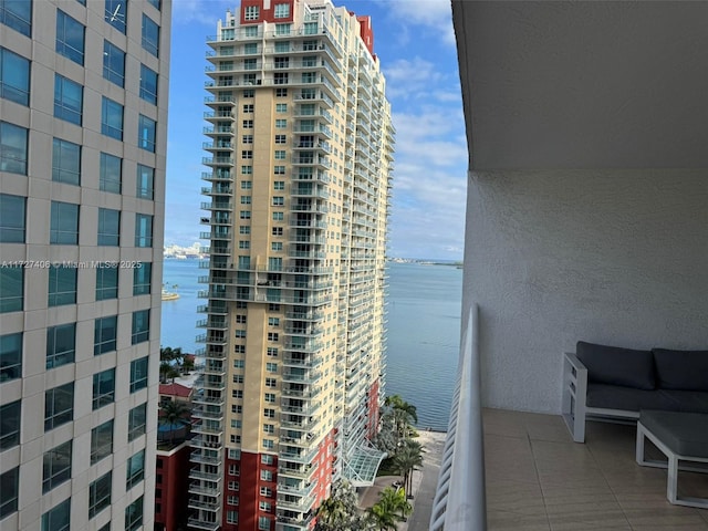 balcony featuring a water view