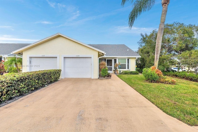 ranch-style house with a garage and a front lawn