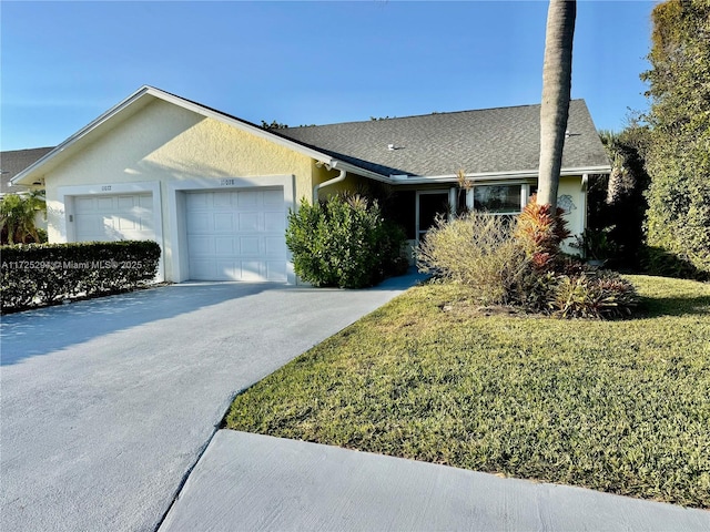 ranch-style house with a front lawn and a garage