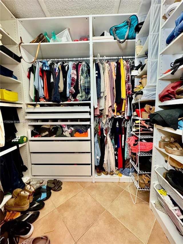 walk in closet featuring tile patterned flooring