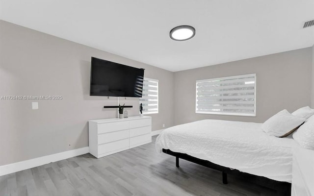 bedroom with light hardwood / wood-style floors