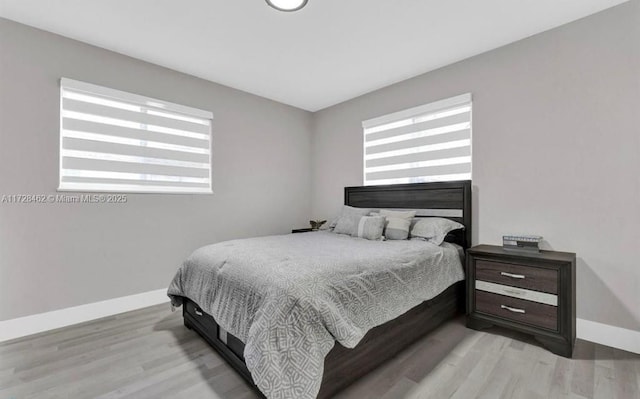 bedroom with light hardwood / wood-style floors