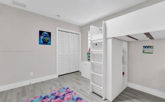 interior space featuring a closet and light hardwood / wood-style flooring