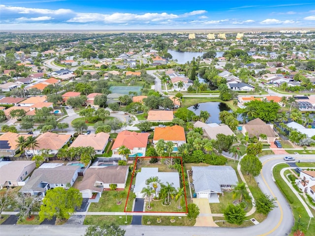 birds eye view of property featuring a water view