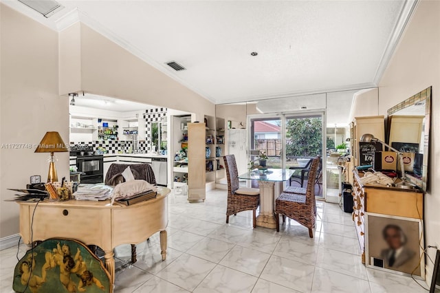 dining space featuring lofted ceiling and crown molding