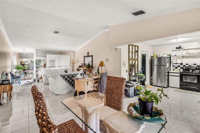 dining space featuring a textured ceiling, ornamental molding, and lofted ceiling