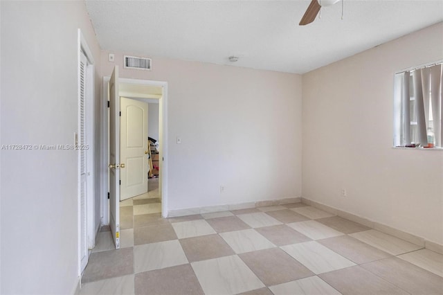 spare room featuring ceiling fan