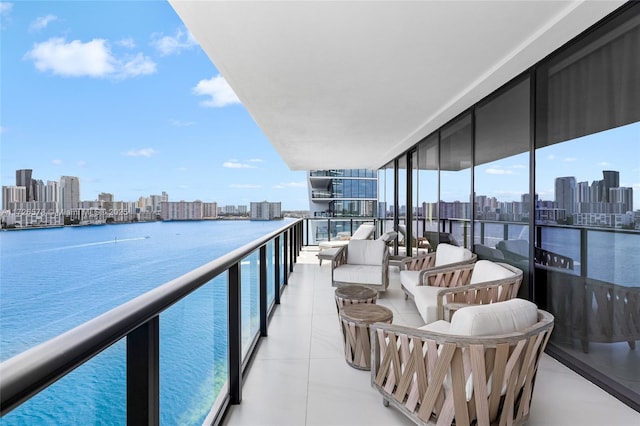 balcony featuring a water view