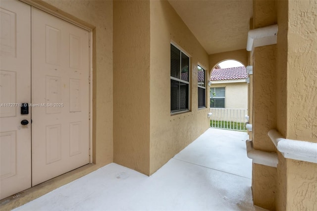 view of exterior entry featuring a porch