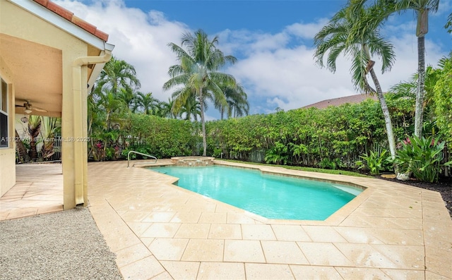 view of pool featuring ceiling fan, an in ground hot tub, and a patio