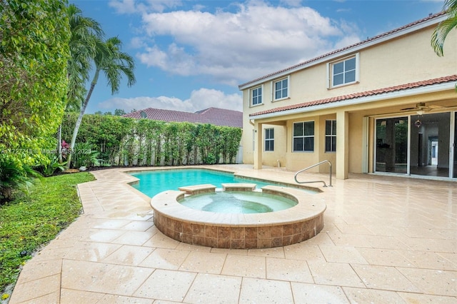 view of pool featuring an in ground hot tub, a patio area, and ceiling fan