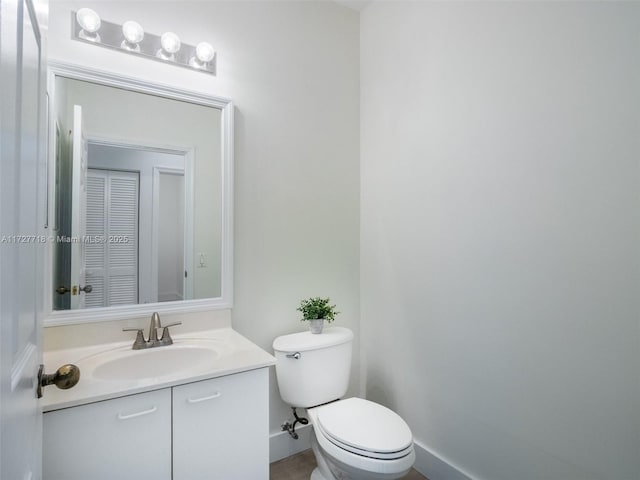 bathroom with toilet and vanity