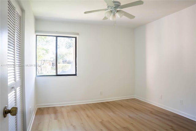 unfurnished room with ceiling fan and light hardwood / wood-style flooring