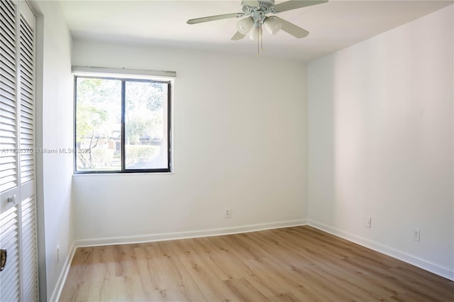 unfurnished room with ceiling fan and light hardwood / wood-style floors