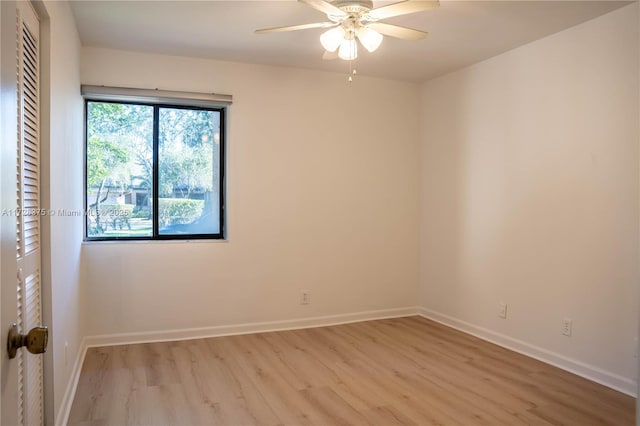 unfurnished room with ceiling fan and light hardwood / wood-style floors