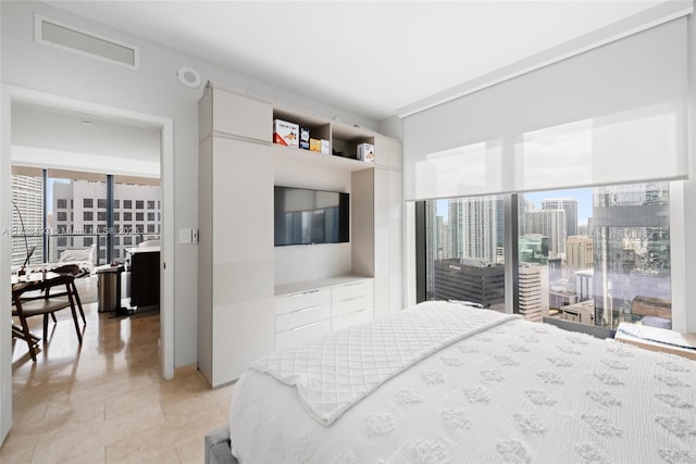 bedroom featuring multiple windows