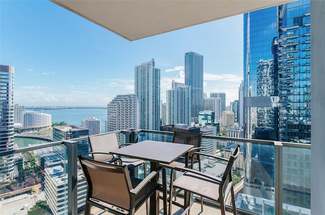 balcony featuring a water view