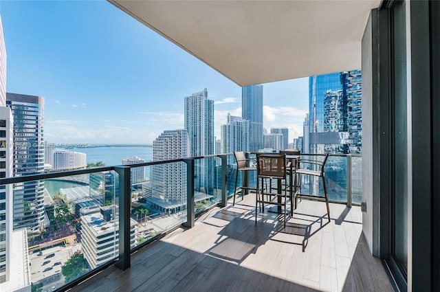 balcony featuring a water view