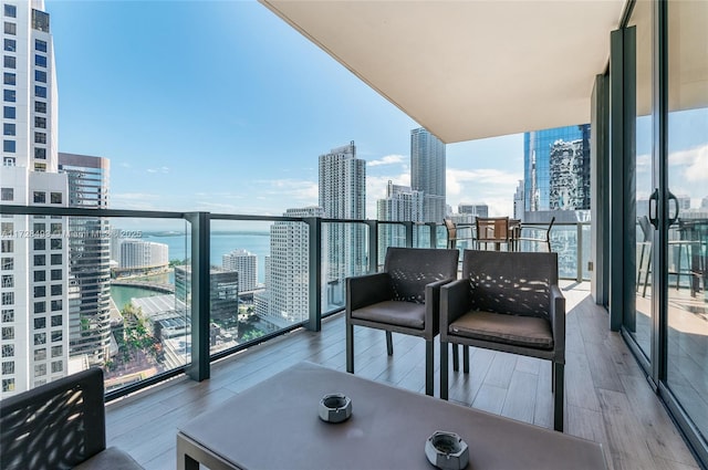 balcony featuring a water view