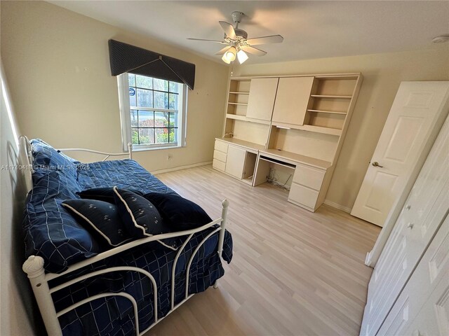 bedroom featuring light wood-type flooring and ceiling fan