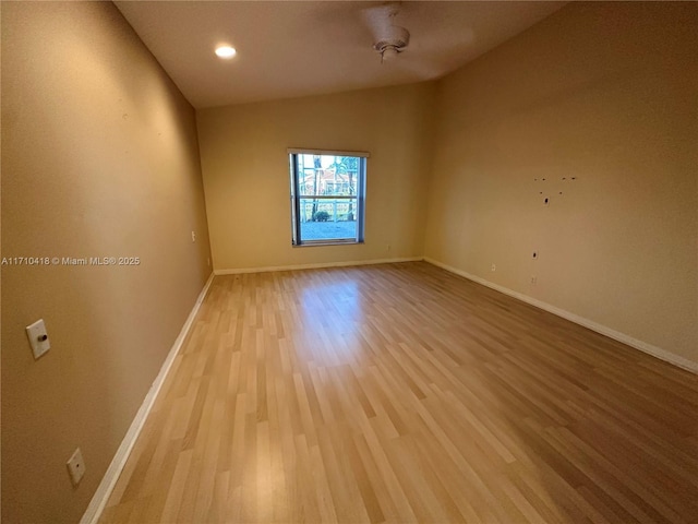 spare room with hardwood / wood-style floors