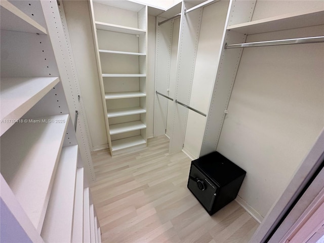 walk in closet featuring light hardwood / wood-style floors