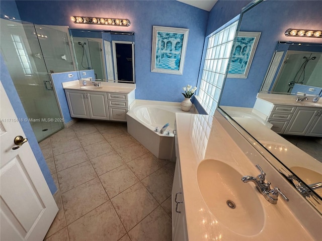 bathroom with separate shower and tub, vanity, and tile patterned floors