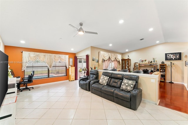 tiled living room with vaulted ceiling and ceiling fan