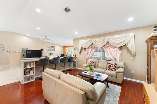 living room with ceiling fan, lofted ceiling, and dark hardwood / wood-style floors