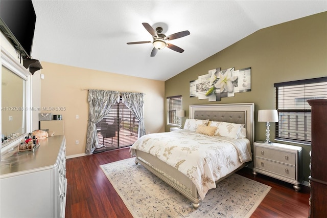 bedroom with ceiling fan, access to exterior, dark hardwood / wood-style flooring, and vaulted ceiling