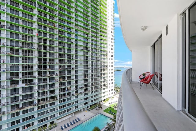 balcony featuring a water view